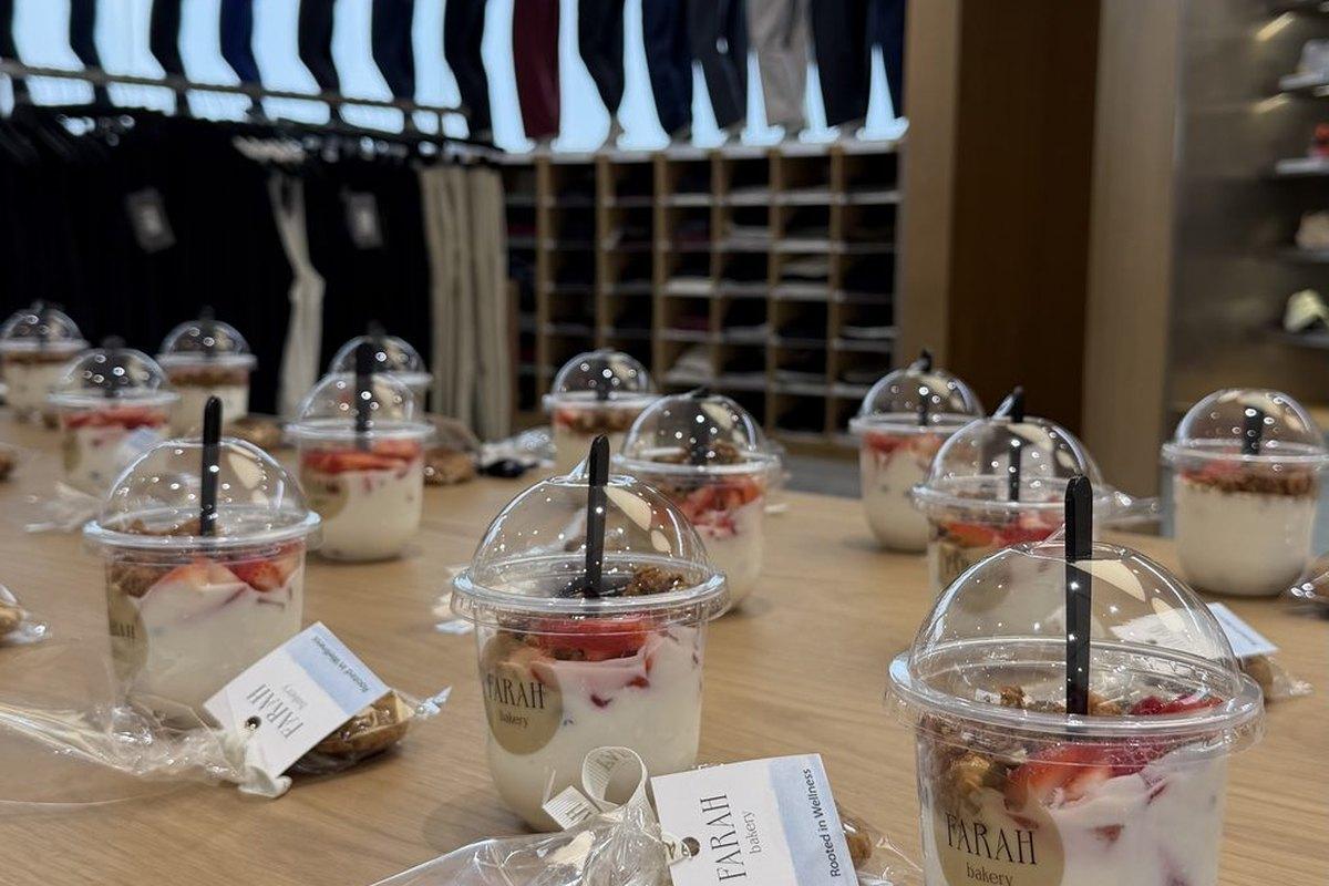 Farah Bakery branded parfait cups laid out on a table at a partner store