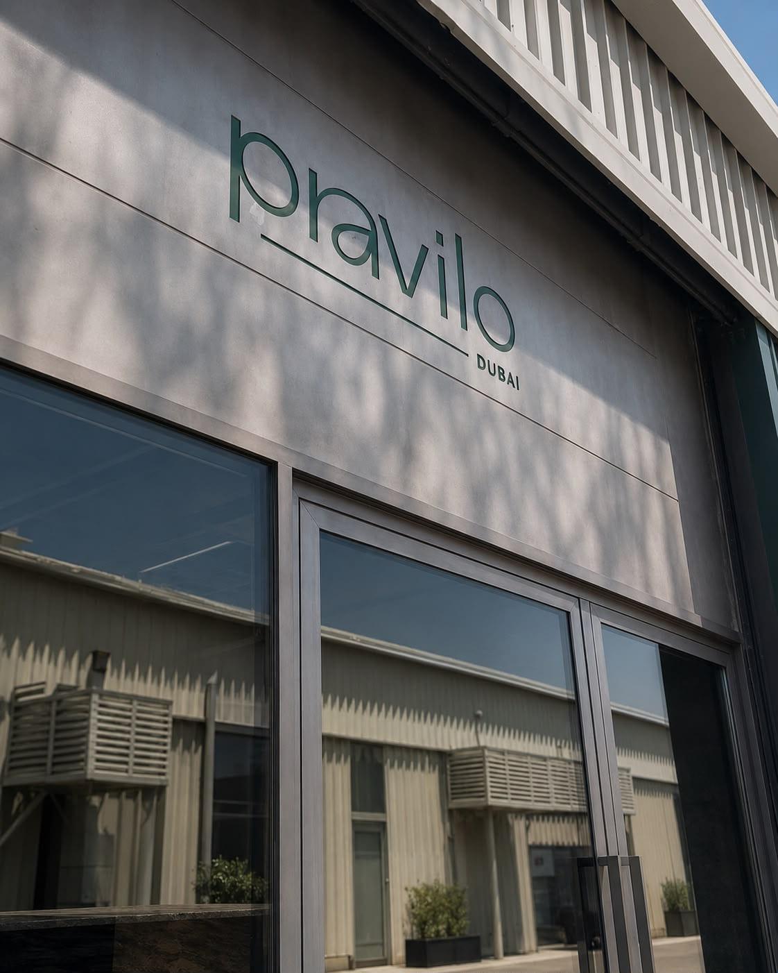The Pravilo entrance in Al Quoz, green lettering on a pale concrete facade